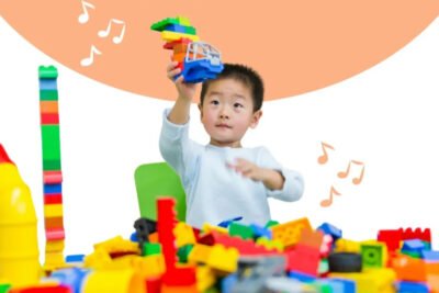 toddler playing with colorful blocks of toys